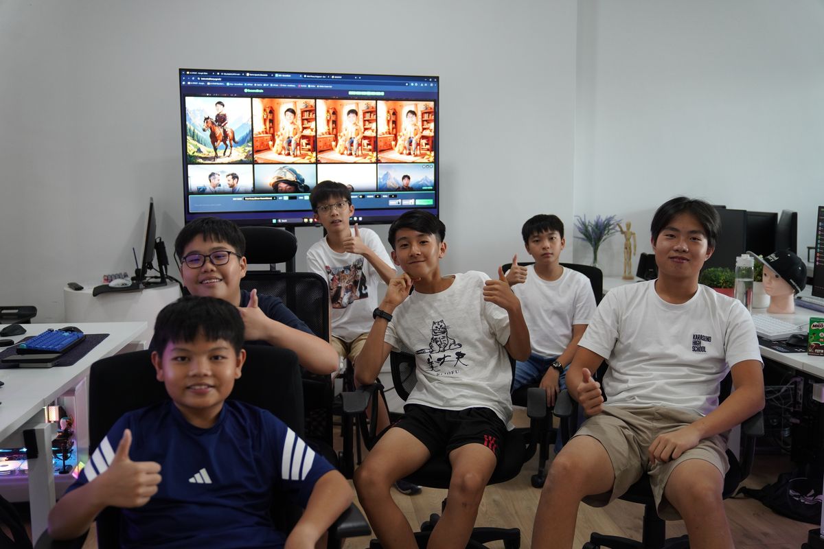 AI Sprint holiday camp students giving a thumbs up in front of their AI art projects at Mind Theory Singapore