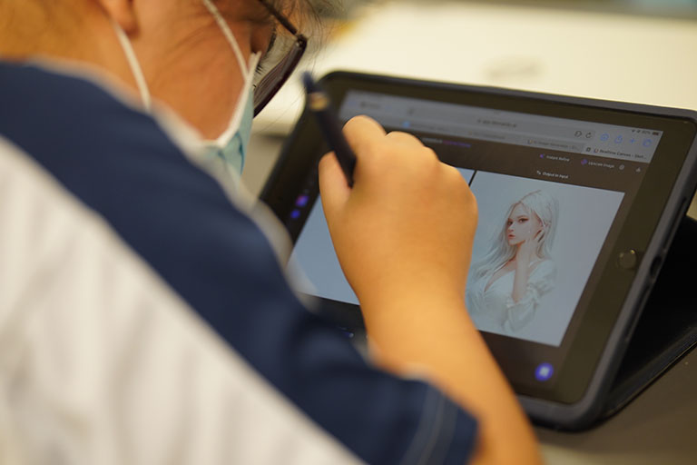 Person draws digital artwork on tablet with stylus