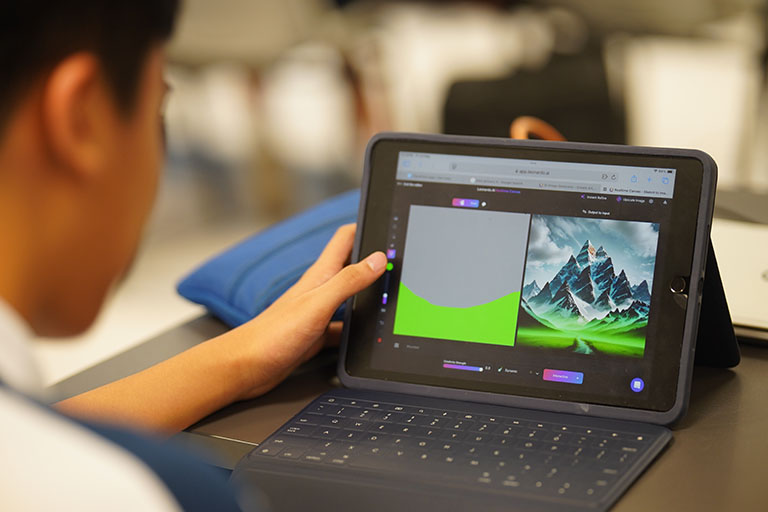 Person uses tablet with keyboard, editing image on screen