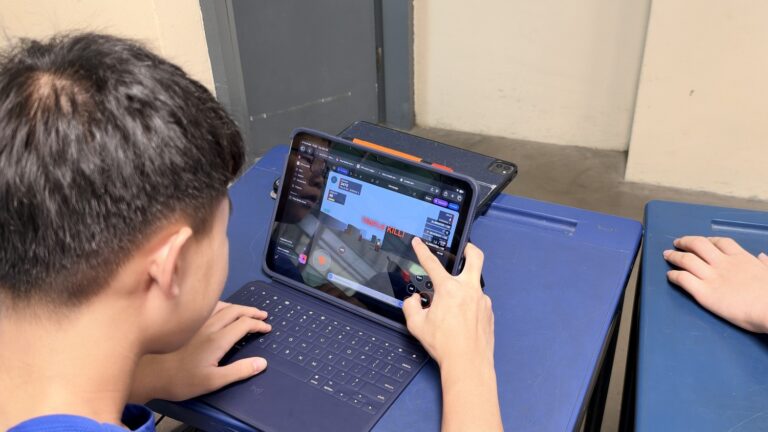Student building a game with AI on a tablet
